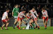18 January 2012; Paul Ward, Fermanagh, in action against Tyrone players, from left, Peter Hughes, PJ Quinn, Sean O'Neill, Colm Cavanagh and Peter Harte. Power NI Dr. McKenna Cup, Section A, Tyrone v Fermanagh, Healy Park, Omagh, Co. Tyrone. Picture credit: Oliver McVeigh / SPORTSFILE