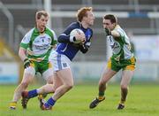 15 January 2012; Declan McKiernan, Cavan, in action against Martin Reilly and Anthony Thompson, left, Donegal. Power NI Dr. McKenna Cup - Section C, Cavan v Donegal, Kingspan Breffni Park, Cavan. Picture credit: Brian Lawless / SPORTSFILE