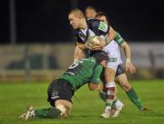 20 January 2012; Mike Brown, Harlequins, is tackled by John Muldoon, Connacht . Heineken Cup, Pool 6, Round 6, Connacht v Harlequins, Sportsground, Galway. Picture credit: David Maher / SPORTSFILE