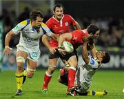 21 January 2012; Paddy Wallace, Ulster, is tackled by Wesley Fofana and Julien Pierre, left, Clermont Auvergne. Heineken Cup, Pool 4, Round 6, Clermont Auvergne v Ulster, Stade Marcel Michelin, Clermont-Ferrand, France. Picture credit: Oliver McVeigh / SPORTSFILE