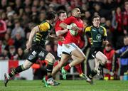 21 January 2012; Simon Zebo, Munster, in action against Ben Foden, Northampton Saints. Heineken Cup, Pool 1 Round 6, Northampton Saints v Munster, Franklin's Gardens, Northampton, England. Picture credit: Matt Impey / SPORTSFILE