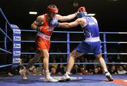 21 January 2012; Darren O'Neill, Paulstown, left, exchanges punches with Stephen O'Reilly, Twintowns, during their 75kg bout. 2012 National Elite Boxing Championships, Preliminaries, National Stadium, Dublin. Picture credit: Stephen McCarthy / SPORTSFILE