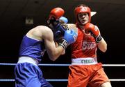 21 January 2012; Darren O'Neill, Paulstown, right, exchanges punches with Stephen O'Reilly, Twintowns, during their 75kg bout. 2012 National Elite Boxing Championships, Preliminaries, National Stadium, Dublin. Picture credit: Stephen McCarthy / SPORTSFILE