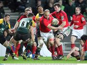 21 January 2012; BJ Botha, Munster, attempts to get past the tackle of Calum Clarke, 6, Northampton Saints. Heineken Cup, Pool 1 Round 6, Northampton Saints v Munster, Franklin's Gardens, Northampton, England. Picture credit: Matt Impey / SPORTSFILE