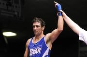 21 January 2012; Kenny Egan, Neilstown, is announced victorious after referee James McCarron stopped his 81kg contest, in the third round, with Michael Frayne, St Marys. 2012 National Elite Boxing Championships, Preliminaries, National Stadium, Dublin. Picture credit: Stephen McCarthy / SPORTSFILE