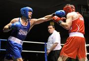 21 January 2012; Kenny Egan, Neilstown, left, exchanges punches with Michael Frayne, St Marys, during their 81kg bout. 2012 National Elite Boxing Championships, Preliminaries, National Stadium, Dublin. Picture credit: Stephen McCarthy / SPORTSFILE