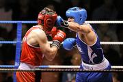 21 January 2012; Kenny Egan, Neilstown, right, exchanges punches with Michael Frayne, St Marys, during their 81kg bout. 2012 National Elite Boxing Championships, Preliminaries, National Stadium, Dublin. Picture credit: Stephen McCarthy / SPORTSFILE