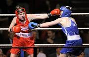 21 January 2012; Michaela Jannick, Cavan, left, exchanges punches with Michelle Lynch, Golden Gloves, during their 54kg female bout. 2012 National Elite Boxing Championships, Preliminaries, National Stadium, Dublin. Picture credit: Stephen McCarthy / SPORTSFILE