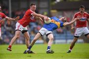 10 June 2017; Jimmy Feehan of Tipperary in action against Paul Kerrigan of Cork during the Munster GAA Football Senior Championship Semi-Final match between Cork and Tipperary at Pairc Ui Rinn in Cork. Photo by Matt Browne/Sportsfile