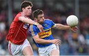 10 June 2017; Liam McGrath of Tipperary in action against Kevin Crowley of Cork during the Munster GAA Football Senior Championship Semi-Final match between Cork and Tipperary at Pairc Ui Rinn in Cork. Photo by Matt Browne/Sportsfile