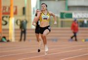 22 January 2012; Phil Healy, Bandon Athletic Club, Co. Cork, on her way to winning the Junior Women's 60m Final at the Woodie’s DIY Junior Indoor Track & Field Championships of Ireland. Nenagh, Co. Tipperary. Picture credit: Matt Browne / SPORTSFILE