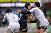 21 January 2012; Mike Ross, Leinster, is tackled by Julien Tomas, left, and Paul Bosch, Montpellier. Heineken Cup, Pool 3, Round 6, Leinster v Montpellier, RDS, Ballsbridge, Dublin. Picture credit: Stephen McCarthy / SPORTSFILE