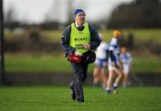 21 January 2012; Physical Therapist Bernie Conroy runs to the attention of an injured Laois player. Bord na Mona Walsh Cup, Laois v Dublin Institute of Technology, Rathdowney-Errill GAA Club, Kelly Daly Park, Rathdowney, Co. Laois. Picture credit: Ray McManus / SPORTSFILE