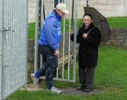 21 January 2012; 'Maor' Tommy Gilmartin attends to the gate as Laois manager Teddy McCarthy enters the field. Bord na Mona Walsh Cup, Laois v Dublin Institute of Technology, Rathdowney-Errill GAA Club, Kelly Daly Park, Rathdowney, Co. Laois. Picture credit: Ray McManus / SPORTSFILE