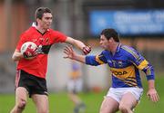 22 January 2012; Shane Betson, UCC, in action against Thomas Ryan, Tipperary. McGrath Cup Football, Semi-Final, Tipperary v University College Cork, Clonmel Sportsfield, Clonmel, Co. Tipperary. Picture credit: Stephen McCarthy / SPORTSFILE