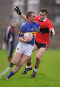 22 January 2012; Peter Acheson, Tipperary, in action against Liam Jennings, UCC. McGrath Cup Football Semi-Final, Tipperary v University College Cork, Clonmel Sportsfield, Clonmel, Co. Tipperary. Picture credit: Stephen McCarthy / SPORTSFILE