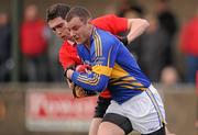 22 January 2012; Lorcan Egan, Tipperary, in action against Shane Betson, UCC. McGrath Cup Football, Semi-Final, Tipperary v University College Cork, Clonmel Sportsfield, Clonmel, Co. Tipperary. Picture credit: Stephen McCarthy / SPORTSFILE