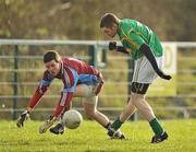 22 January 2012; Alan Wynne, Leitrim, beats G.M.I.T. goalkeeper Paul Mannion to score his side's first goal. FBD Insurance League, Section B, Round 3, G.M.I.T. v Leitrim, Strokestown GAA Grounds, Farnbeg, Strokestown, Co. Roscommon. Picture credit: David Maher / SPORTSFILE