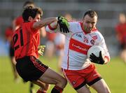 22 January 2012; Paddy Bradley, Derry, in action against Donnacha O'Higgins, Down. Power NI Dr. McKenna Cup, Semi-Final, Derry v Down, Morgan Athletic Grounds, Armagh. Picture credit: Oliver McVeigh / SPORTSFILE
