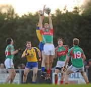 22 January 2012; Jason Gibbons, Mayo, supported by team-mates, from left, Kevin McLoughlin, Alan Freeman, and Alan Feeney, contests a high ball against Roscommon's Michael Finneran, supported by team-mate Sean Purcell, left. FBD Insurance League, Section B, Round 3, Roscommon v Mayo, Ballinlough GAA Grounds, Ballinlough, Co. Roscommon. Picture credit: Pat Murphy / SPORTSFILE