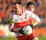 22 January 2012; Paddy Bradley, Derry, in action against Donnacha O'Higgins, Down. Power NI Dr. McKenna Cup Semi-Final, Derry v Down, Morgan Athletic Grounds, Armagh. Picture credit: Oliver McVeigh / SPORTSFILE
