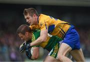 11 June 2017; Fionn Fitzgerald of Kerry is fouled by Ciarán Russell of Clare during the Munster GAA Football Senior Championship Semi-Final match between Kerry and Clare at Cusack Park, in Ennis, Co. Clare. Photo by Sam Barnes/Sportsfile