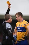 11 June 2017; Referee Pádraig Hughes shows Ciarán Russell of Clare a yellow card during the Munster GAA Football Senior Championship Semi-Final match between Kerry and Clare at Cusack Park, in Ennis, Co. Clare. Photo by Sam Barnes/Sportsfile