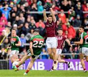 11 June 2017; Evan Regan of Mayo under pressure from Michael Lundy of Galway takes a last second kick on goal, which went wide, during the Connacht GAA Football Senior Championship Semi-Final match between Galway and Mayo at Pearse Stadium, in Salthill, Galway. Photo by Ray McManus/Sportsfile