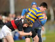 24 January 2012; Cillian O'Leary, Skerries Community College, is tackled by Stephen Crosby, The High School. Powerade Leinster Schools Fr. Godfrey Cup, 2nd Round, Skerries Community College v The High School, Suttonians RFC, Sutton, Co. Dublin. Picture credit: Brian Lawless / SPORTSFILE
