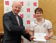 25 January 2012; Ireland's latest Olympic team member, gymnast Kieran Behan, is presented with a cheque for €20,000 by Patrick Hickey, President, Olympic Council of Ireland, to assist in his preparations for the London Olympic Games later this year. The 22 year old, who was told he would never walk again after a childhood illness, has overcome enormous obstacles to be the first Irish gymnast to qualify for the games since 1996. Shelbourne Hotel, Dublin. Picture credit: Brendan Moran / SPORTSFILE