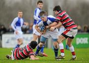 25 January 2012; Nathan Veltom, St. Andrew’s School, is tackled by Eric Parfrey, left, and Sam Pollock, Wesley College. Powerade Leinster Schools Vinnie Murray Cup, Semi-Final, Wesley College v St. Andrew’s School, Seapoint RFC, Killiney, Co. Dublin. Picture credit: Brian Lawless / SPORTSFILE