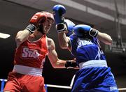 27 January 2012; John Joe Nevin, left, Cavan Boxing Club, in action against Sean McComb, Holy Trinity Boxing Club, during their 56kg bout. 2012 National Elite Boxing Championship Semi-Finals, National Stadium, Dublin. Picture credit: David Maher / SPORTSFILE