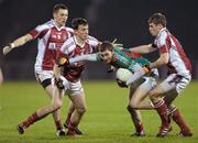 27 January 2012; Keith Higgins, Mayo, in action against Fiachra Deasmhunaigh, left, Jason Doherty, and Neil Douglas, right, N.U.I. Galway. FBD Insurance League Home Final, N.U.I. Galway v Mayo, McHale Park, Castlebar, Co. Mayo. Photo by Sportsfile
