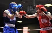 27 January 2012; Ross Hickey, right, Grangecon Boxing Club, in action against Niall Murray, Gorey Boxing Club, Co. Wexford, during their 64kg bout. 2012 National Elite Boxing Championship Semi-Finals, National Stadium, Dublin. Picture credit: David Maher / SPORTSFILE
