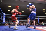 27 January 2012; Ross Hickey, left, Grangecon Boxing Club, in action against Niall Murray, Gorey Boxing Club, Co. Wexford, during their 64kg bout. 2012 National Elite Boxing Championship Semi-Finals, National Stadium, Dublin. Picture credit: David Maher / SPORTSFILE