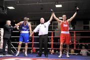 27 January 2012; Darren O'Neill, right, Paulstown Boxing Club, is announced as the winner over Conrad Cummings , Holy Trinity Boxing Club, at the end of their 75kg bout. 2012 National Elite Boxing Championship Semi-Finals, National Stadium, Dublin. Picture credit: David Maher / SPORTSFILE