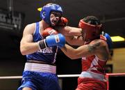 27 January 2012; Tommy McCarthy, right, Oliver Plunkett Boxing Club, in action against Stephen Ward, Monkstown Antrim Boxing Club during their 91kg bout. 2012 National Elite Boxing Championship Semi-Finals, National Stadium, Dublin. Picture credit: David Maher / SPORTSFILE