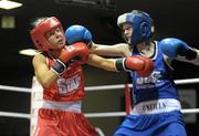 28 January 2012; Emma Duffy, Crumlin, left, exchanges punches with  Ceire Smith, Cavan, during their 51 kg bout. 2012 National Elite Boxing Championship Semi-Finals, National Stadium, Dublin. Photo by Sportsfile