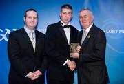28 January 2012; Uachtarán CLG Criostóir Ó Cuana presents Shane Nolan, from Kerry, with his Christy Ring award, alongside Alan Smullen, General Manager, Croke Park Hotel. The Christy Ring, Nicky Rackard & Lory Meagher Champion 15 Awards 2011, Croke Park, Dublin. Picture credit: Barry Cregg / SPORTSFILE
