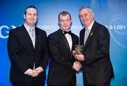 28 January 2012; Uachtarán CLG Criostóir Ó Cuana presents Eoin Clarke, from Down, with his Christy Ring award, alongside Alan Smullen, General Manager, Croke Park Hotel. The Christy Ring, Nicky Rackard & Lory Meagher Champion 15 Awards 2011, Croke Park, Dublin. Picture credit: Barry Cregg / SPORTSFILE