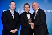 28 January 2012; Uachtarán CLG Criostóir Ó Cuana presents Cahal Carvill, from Armagh, with his Christy Ring award, alongside Alan Smullen, General Manager, Croke Park Hotel. The Christy Ring, Nicky Rackard & Lory Meagher Champion 15 Awards 2011, Croke Park, Dublin. Picture credit: Barry Cregg / SPORTSFILE