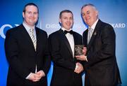 28 January 2012; Uachtarán CLG Criostóir Ó Cuana presents Niall Campbell, from Donegal, with his Lory Meagher award, alongside Alan Smullen, General Manager, Croke Park Hotel. The Christy Ring, Nicky Rackard & Lory Meagher Champion 15 Awards 2011, Croke Park, Dublin. Picture credit: Barry Cregg / SPORTSFILE