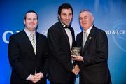 28 January 2012; Uachtarán CLG Criostóir Ó Cuana presents Joe Boyle, from Donegal, with his Lory Meagher award, alongside Alan Smullen, General Manager, Croke Park Hotel. The Christy Ring, Nicky Rackard & Lory Meagher Champion 15 Awards 2011, Croke Park, Dublin. Picture credit: Barry Cregg / SPORTSFILE
