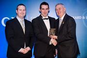 28 January 2012; Uachtarán CLG Criostóir Ó Cuana presents Damien Maguire, from Tyrone, with his Lory Meagher award, alongside Alan Smullen, General Manager, Croke Park Hotel. The Christy Ring, Nicky Rackard & Lory Meagher Champion 15 Awards 2011, Croke Park, Dublin. Picture credit: Barry Cregg / SPORTSFILE