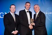28 January 2012; Uachtarán CLG Criostóir Ó Cuana presents Ryan Winters, from Tyrone, with his Lory Meagher award, alongside Alan Smullen, General Manager, Croke Park Hotel. The Christy Ring, Nicky Rackard & Lory Meagher Champion 15 Awards 2011, Croke Park, Dublin. Picture credit: Barry Cregg / SPORTSFILE