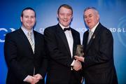 28 January 2012; Uachtarán CLG Criostóir Ó Cuana presents Eoin McGuinness, from South Down, with his Lory Meagher award, alongside Alan Smullen, General Manager, Croke Park Hotel. The Christy Ring, Nicky Rackard & Lory Meagher Champion 15 Awards 2011, Croke Park, Dublin. Picture credit: Barry Cregg / SPORTSFILE