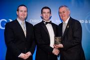 28 January 2012; Uachtarán CLG Criostóir Ó Cuana presents Liam Morgan, from South Down, with his Lory Meagher award, alongside Alan Smullen, General Manager, Croke Park Hotel. The Christy Ring, Nicky Rackard & Lory Meagher Champion 15 Awards 2011, Croke Park, Dublin. Picture credit: Barry Cregg / SPORTSFILE