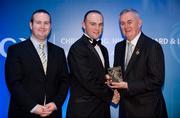 28 January 2012; Uachtarán CLG Criostóir Ó Cuana presents Fergus Bannon, from Fermanagh, with his Lory Meagher award, alongside Alan Smullen, General Manager, Croke Park Hotel. The Christy Ring, Nicky Rackard & Lory Meagher Champion 15 Awards 2011, Croke Park, Dublin. Picture credit: Barry Cregg / SPORTSFILE