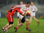 28 January 2012; Stephen O'Neill, Tyrone, in action against Ryan Dillon, Derry. Power NI Dr. McKenna Cup Final, Derry v Tyrone, Morgan Athletic Grounds, Armagh. Picture credit: Oliver McVeigh / SPORTSFILE