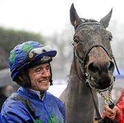 29 January 2012; Jockey Ruby Walsh in the the parade ring with Hurricane Fly after winning the BHP Insurance Irish Champion Hurdle. Leopardstown Racecourse, Leopardstown, Co. Dublin. Picture credit: Barry Cregg / SPORTSFILE